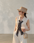 Chic polo-style tweed vest with a matching scarf.