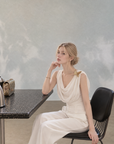Asymmetrical Draped Neckline Top with Bow Brooch