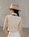 Chic polo-style tweed vest with a matching scarf.