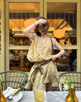 Linen‑blend sleeveless dress with 3D paisley embroidery.
