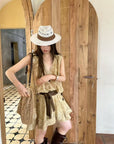 Linen‑blend sleeveless dress with 3D paisley embroidery.