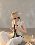 Chic polo-style tweed vest with a matching scarf.