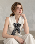 Chic polo-style tweed vest with a matching scarf.