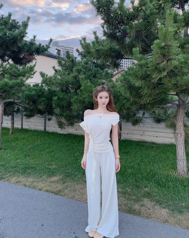 Asymmetric off-shoulder ruffle-drape top