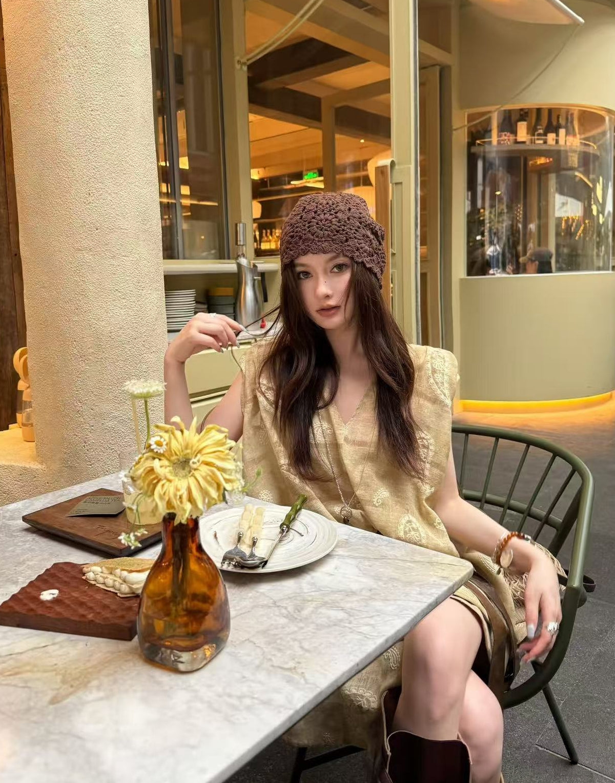 Linen‑blend sleeveless dress with 3D paisley embroidery.