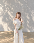 Asymmetric off-shoulder ruffle-drape top