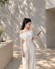 Asymmetric off-shoulder ruffle-drape top