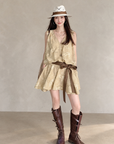 Linen‑blend sleeveless dress with 3D paisley embroidery.