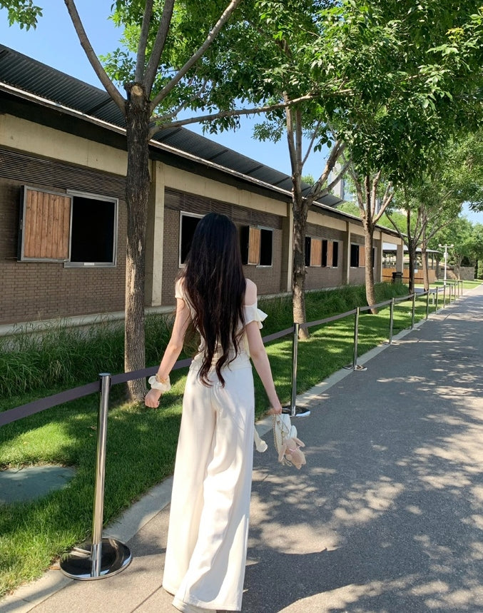 Asymmetric off-shoulder ruffle-drape top