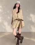 Linen‑blend sleeveless dress with 3D paisley embroidery.
