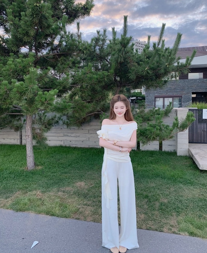 Asymmetric off-shoulder ruffle-drape top