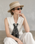 Chic polo-style tweed vest with a matching scarf.