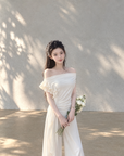 Asymmetric off-shoulder ruffle-drape top