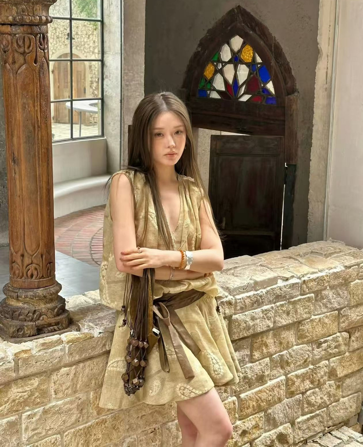 Linen‑blend sleeveless dress with 3D paisley embroidery.