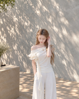Asymmetric off-shoulder ruffle-drape top