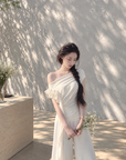 Asymmetric off-shoulder ruffle-drape top