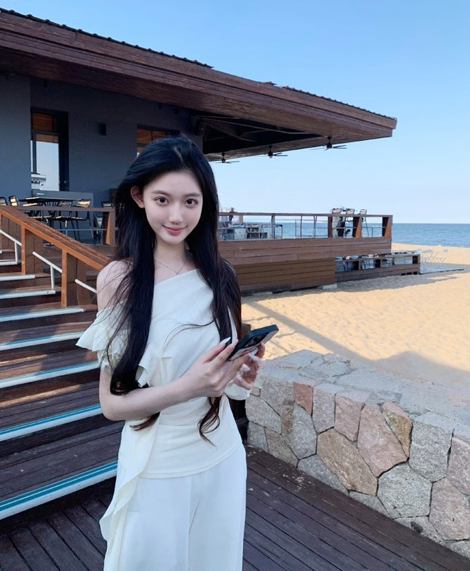 Asymmetric off-shoulder ruffle-drape top