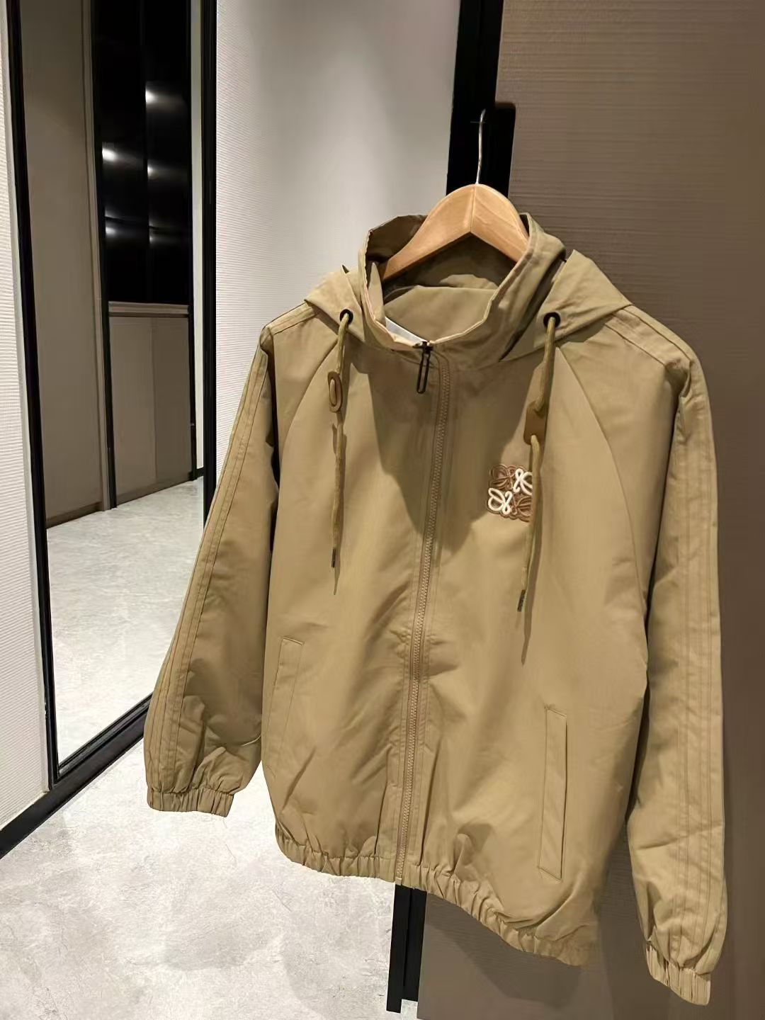 Khaki hooded windbreaker jacket