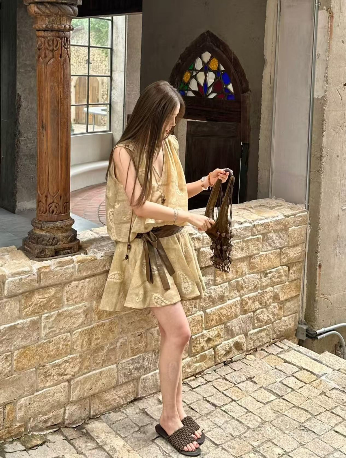 Linen‑blend sleeveless dress with 3D paisley embroidery.