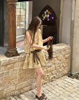 Linen‑blend sleeveless dress with 3D paisley embroidery.