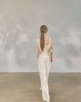 Asymmetrical Draped Neckline Top with Bow Brooch