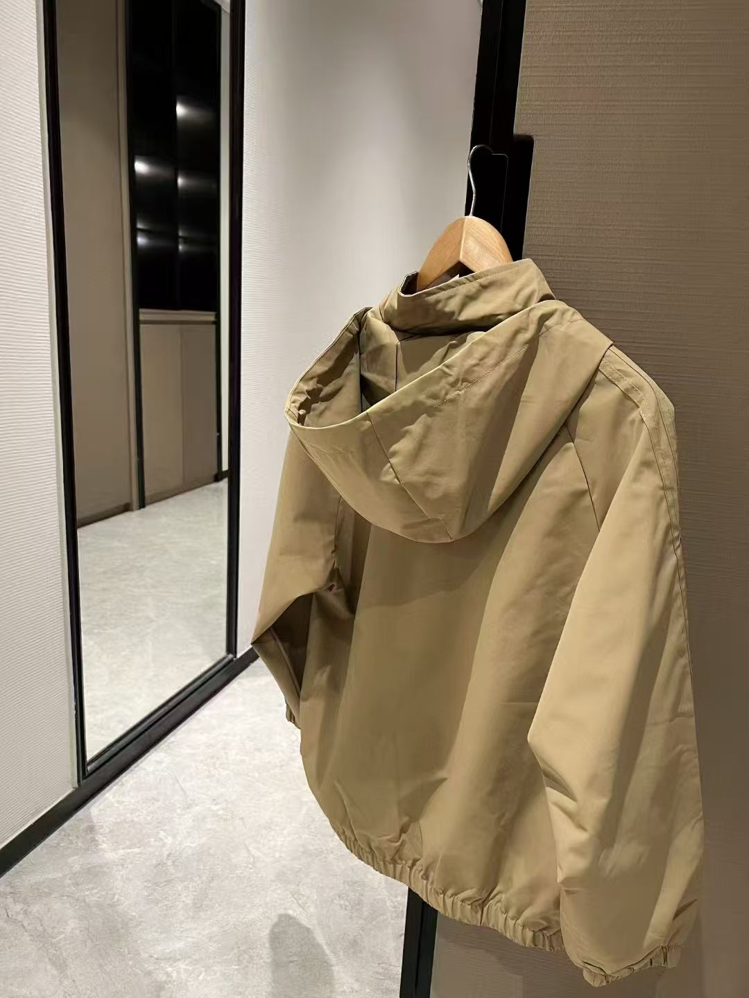 Khaki hooded windbreaker jacket