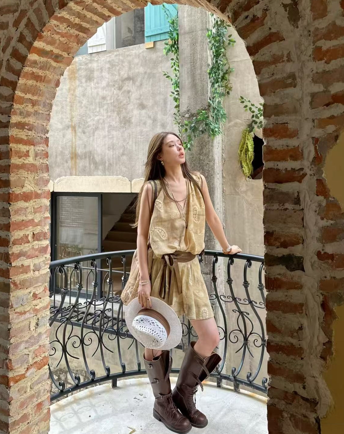 Linen‑blend sleeveless dress with 3D paisley embroidery.