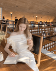Asymmetric off-shoulder ruffle-drape top