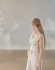 Asymmetrical Draped Neckline Top with Bow Brooch