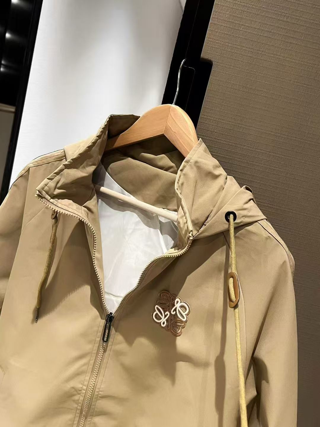 Khaki hooded windbreaker jacket